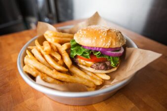 a sandwich with lettuce and fries on a plate